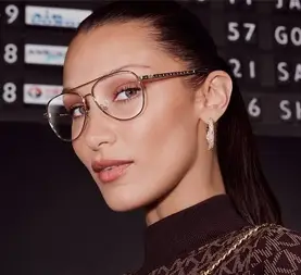 Woman wearing gold aviator-style glasses