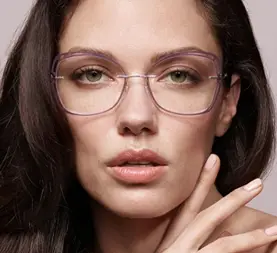 Woman wearing translucent lilac glasses
